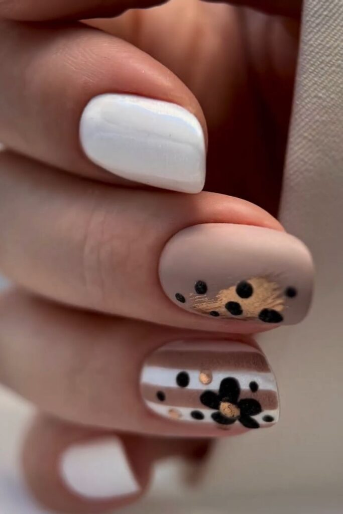 White square nails with subtle leopard print accent nails.